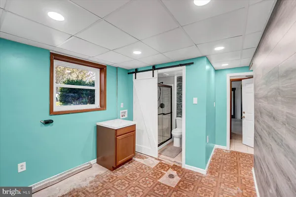 a view of a room with furniture and window