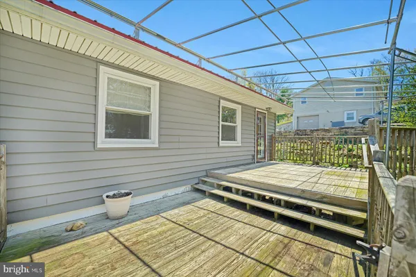 a balcony with wooden floor