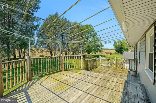 a view of a balcony with wooden floor