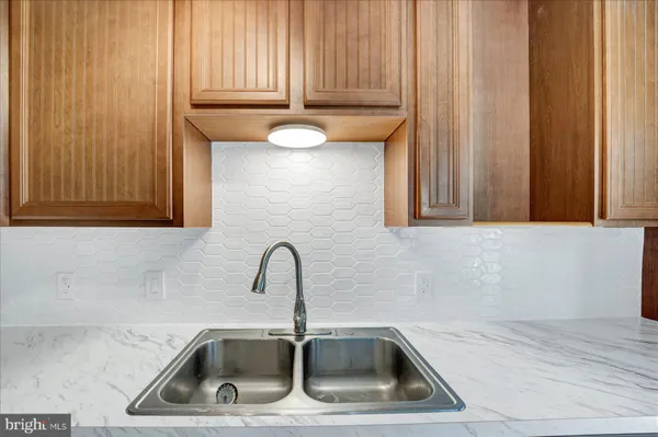 a kitchen with a sink and a window
