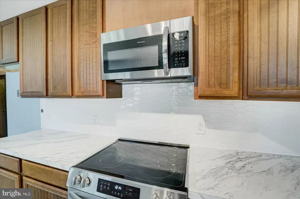 a kitchen with a stove and a microwave
