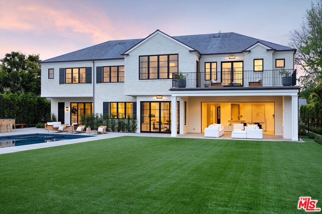 714 Alta Drive Beverly Hills, CA 90210 - Photo 1 of 29 a front view of a house with a yard