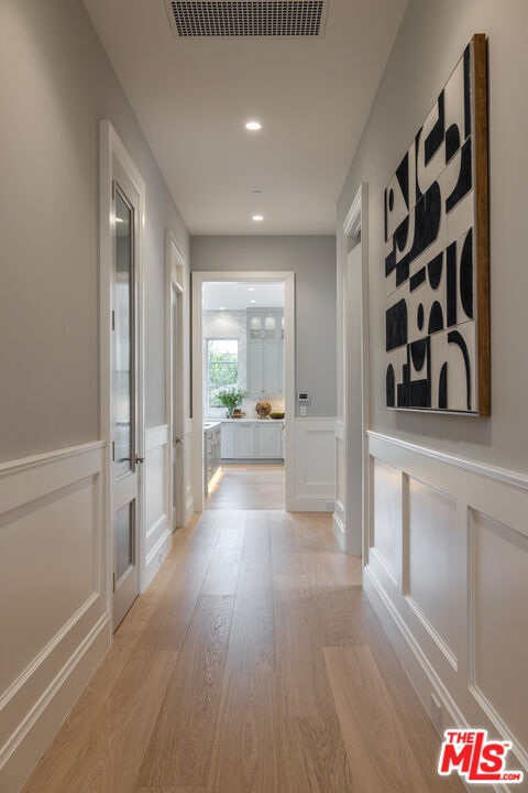 714 Alta Drive Beverly Hills, CA 90210 - Photo 17 of 29 wooden floor in an empty room with a window
