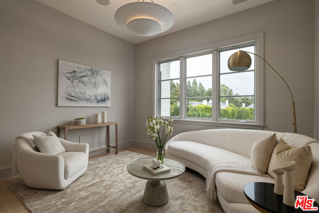 714 Alta Drive Beverly Hills, CA 90210 - Photo 21 of 29 a living room with furniture and a large window