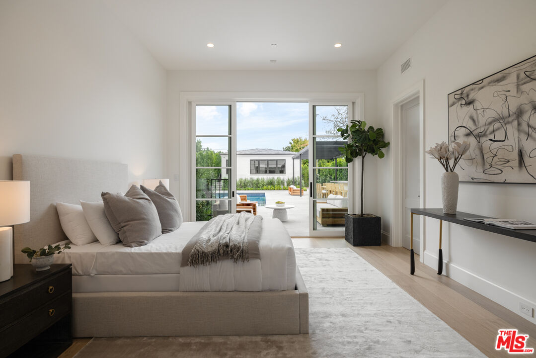 714 Alta Drive Beverly Hills, CA 90210 - Photo 28 of 29 a living room with furniture and a large window