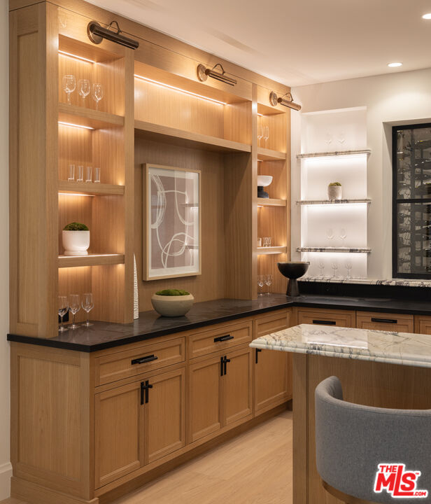 714 Alta Drive Beverly Hills, CA 90210 - Photo 29 of 29 a bathroom with a granite countertop tub sink and mirror