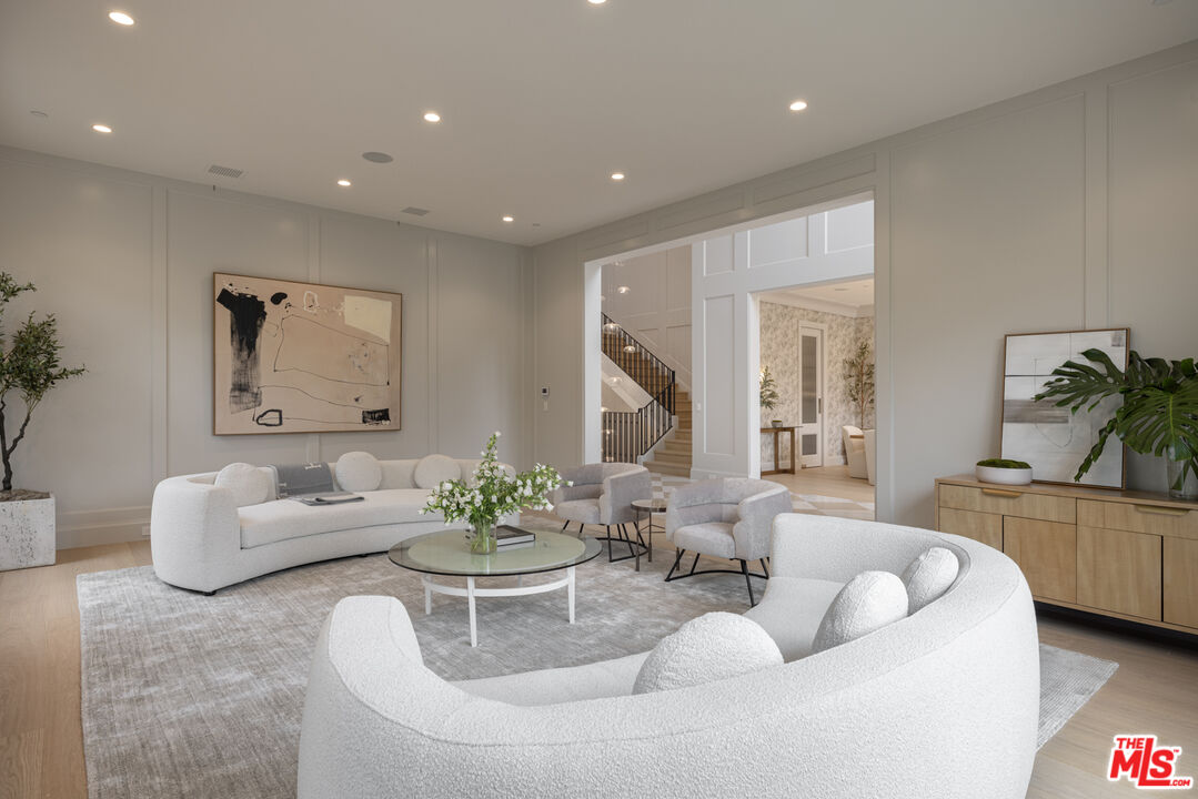 714 Alta Drive Beverly Hills, CA 90210 - Photo 8 of 29 a living room with furniture and a large window