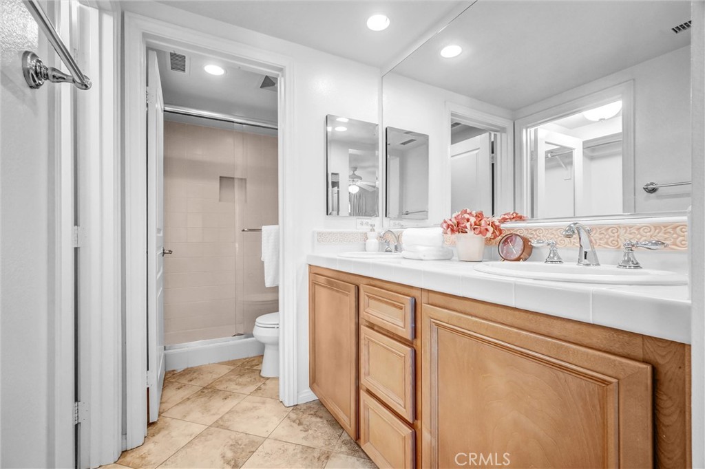 12 Shellprint Court Newport Beach, CA 92663 - Photo 26 of 42 Primary Bathroom with Dual Sinks, Separate Private Water Closet with walk-in Shower