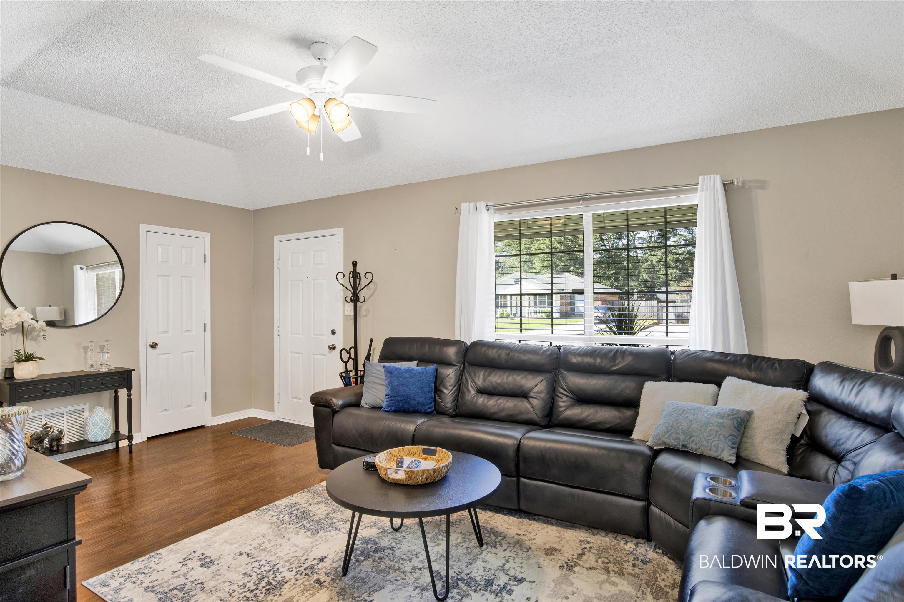 6281 Woodside Drive Theodore, AL 36582 - Photo 4 of 17 Living area with dark wood-type flooring, a textured ceiling, and ceiling fan