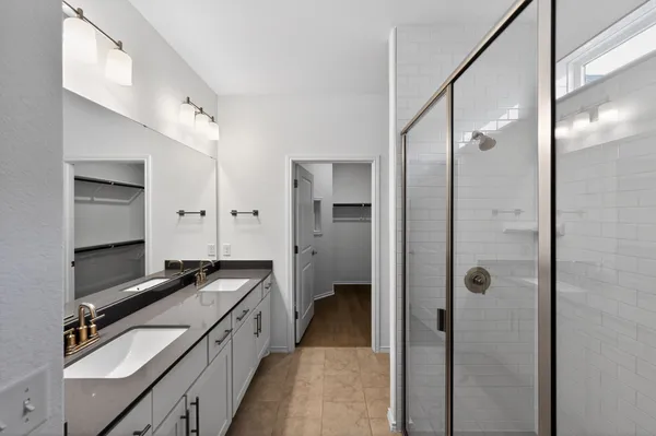 a kitchen with a refrigerator and a sink