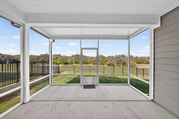 a view of a balcony with floor to ceiling window