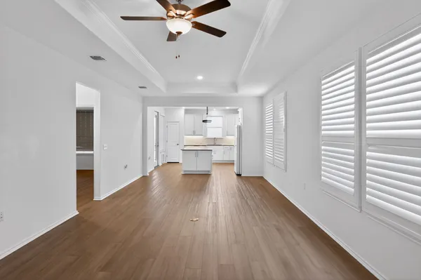 a view of a kitchen with a sink and a window