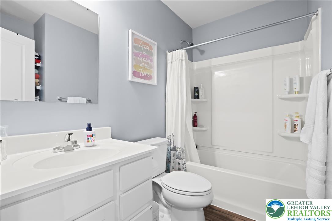 2336 Alex Road Easton, PA 18040 - Photo 14 of 35 A pristine full bathroom, thoughtfully designed with contemporary fixtures and a shower-tub combination.