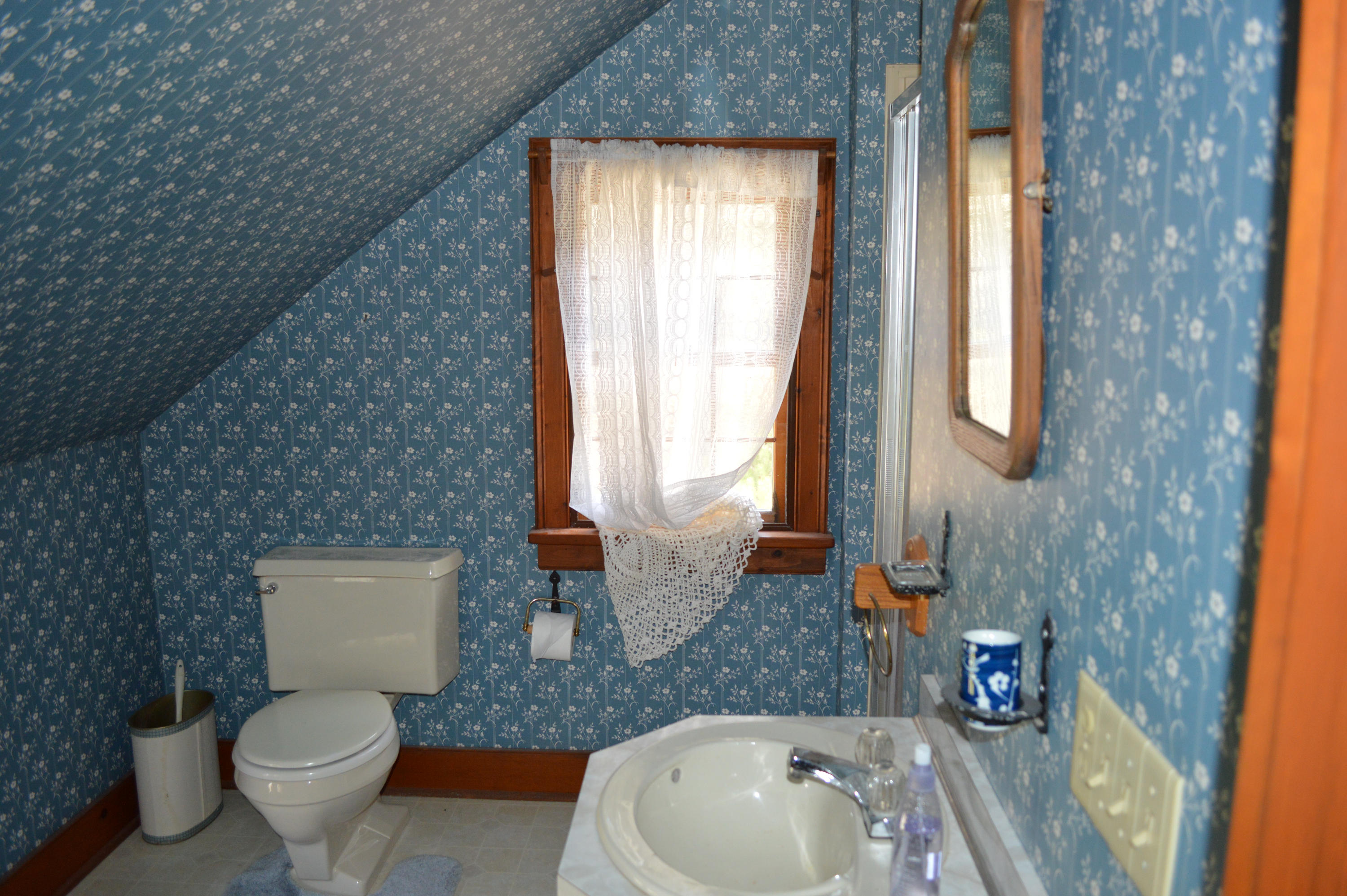 256 Middlefield Road Washington, MA 01223 - Photo 23 of 45 a bathroom with a toilet sink and mirror