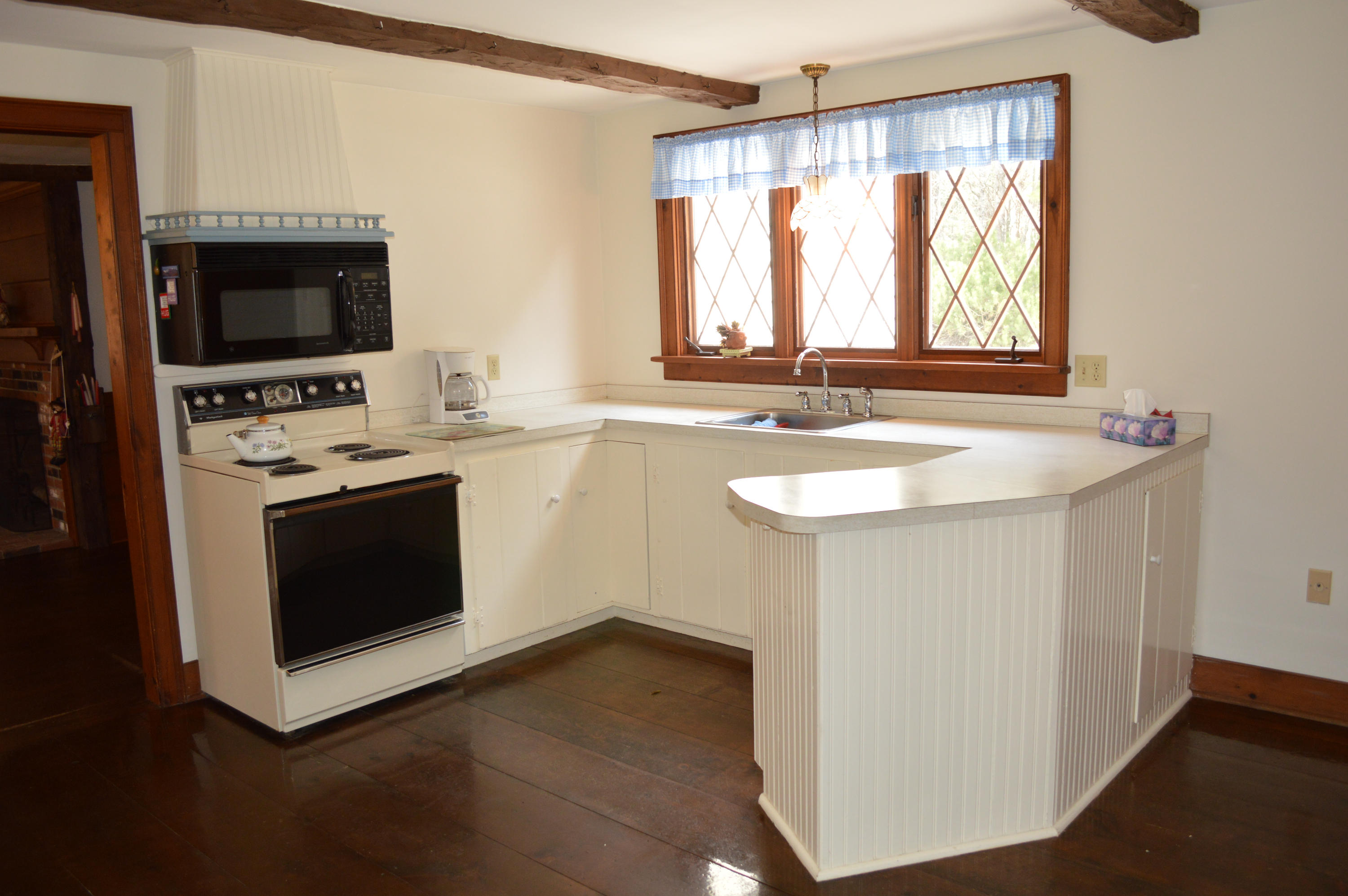 256 Middlefield Road Washington, MA 01223 - Photo 31 of 45 a kitchen with a stove and a sink