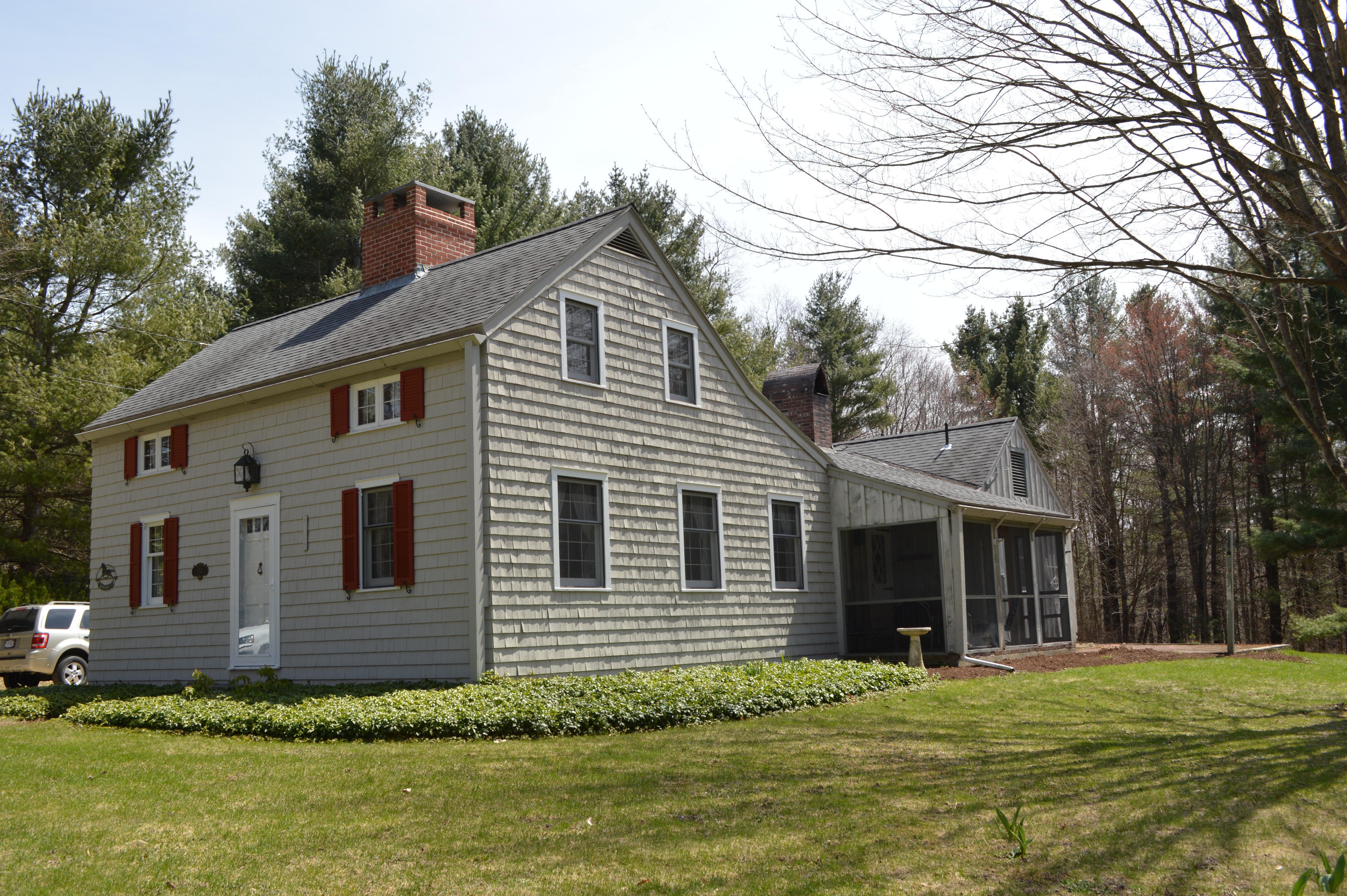 256 Middlefield Road Washington, MA 01223 - Photo 44 of 45 a front view of a house with a garden