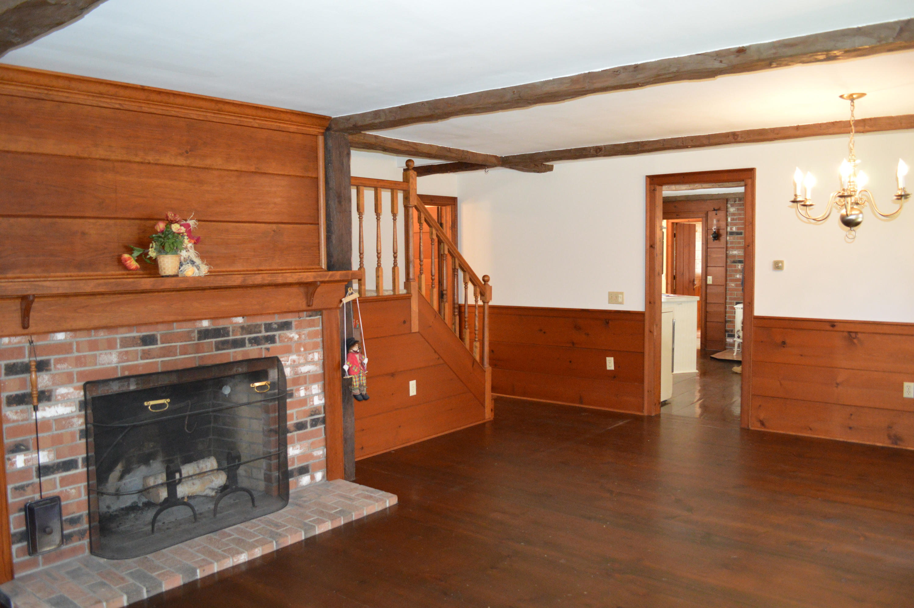 256 Middlefield Road Washington, MA 01223 - Photo 7 of 45 a living room with furniture and a fireplace