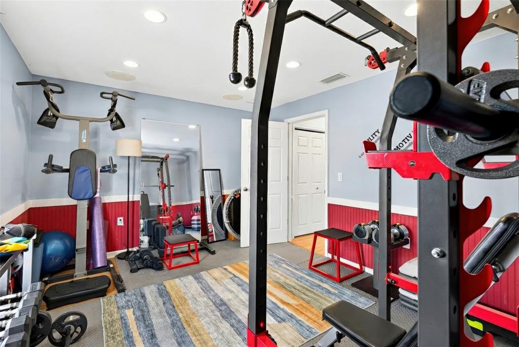 5940 Northeast 57th Loop Silver Springs, FL 34488 - Photo 11 of 44 a view of gym equipment and children play room