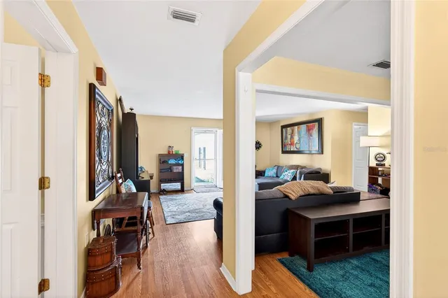 a view of a livingroom with furniture and a flat screen tv