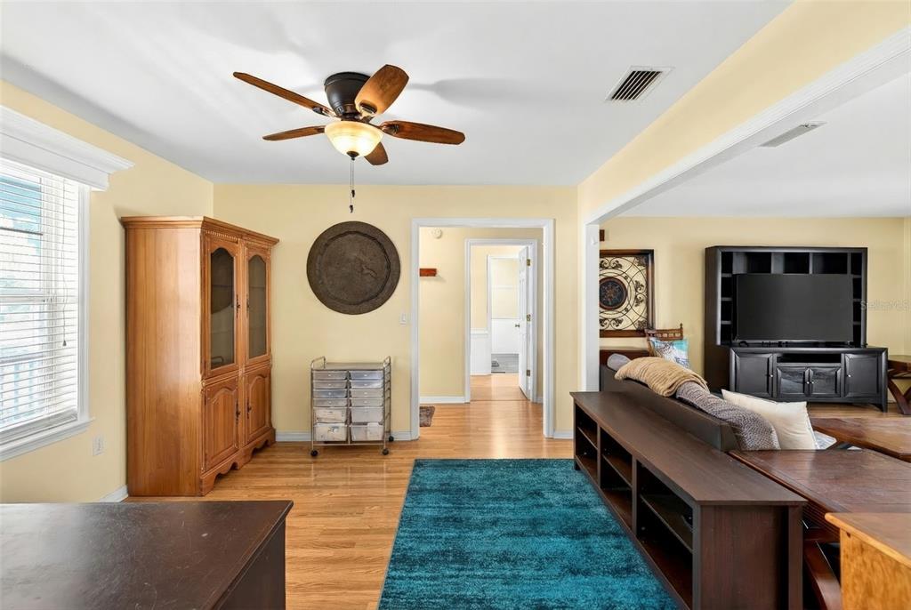 5940 Northeast 57th Loop Silver Springs, FL 34488 - Photo 15 of 44 a living room with furniture and a flat screen tv