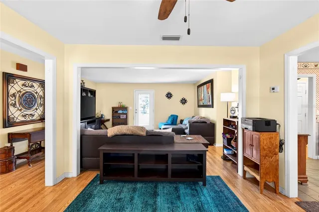 a bedroom with furniture and a wooden floor