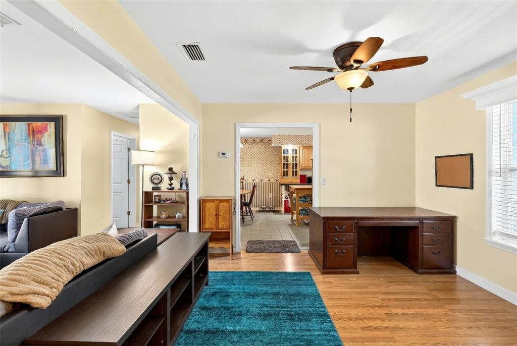 5940 Northeast 57th Loop Silver Springs, FL 34488 - Photo 18 of 44 a living room with furniture and a wooden floor