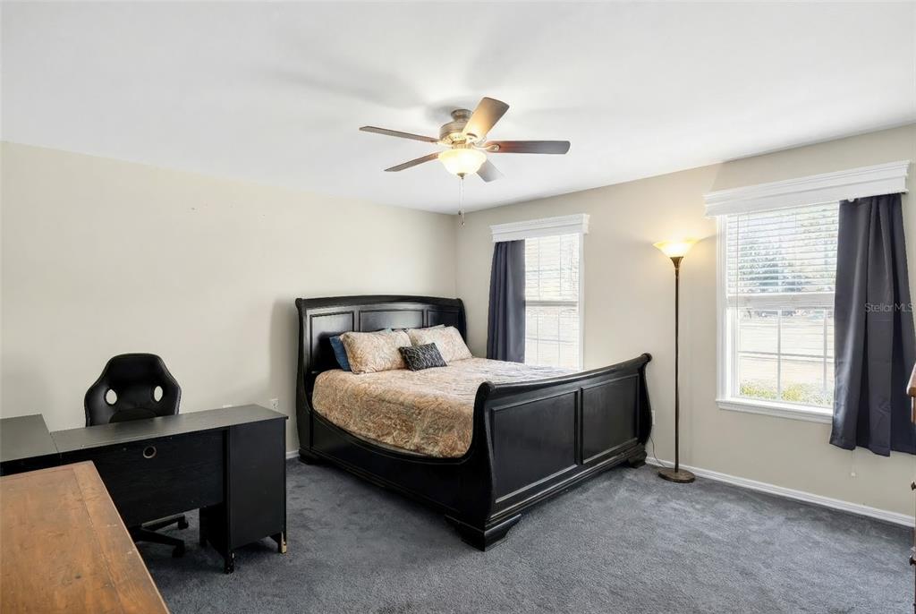 5940 Northeast 57th Loop Silver Springs, FL 34488 - Photo 24 of 44 a bedroom with a bed and a window