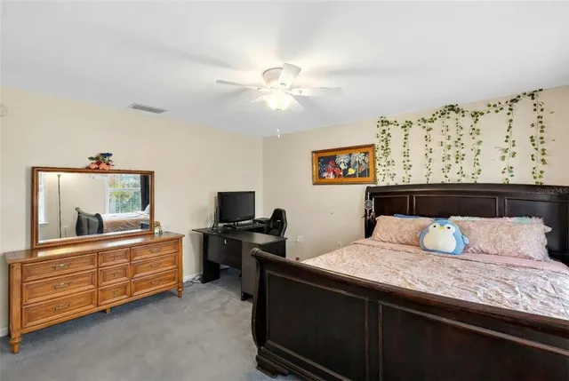 a bedroom with a bed and a dresser