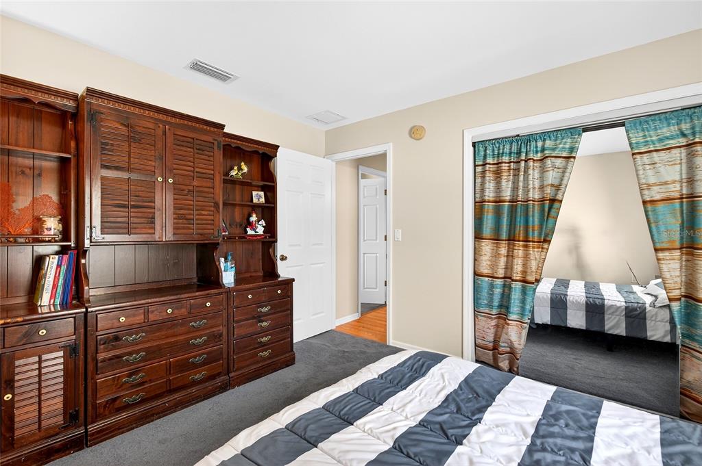 5940 Northeast 57th Loop Silver Springs, FL 34488 - Photo 28 of 44 a bedroom with a bed and furniture