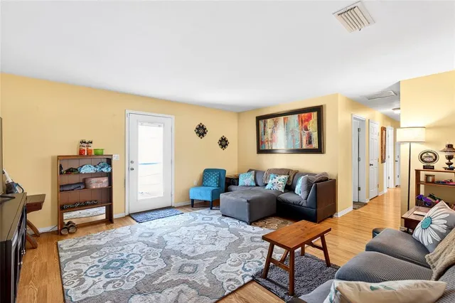 a living room with furniture and a window