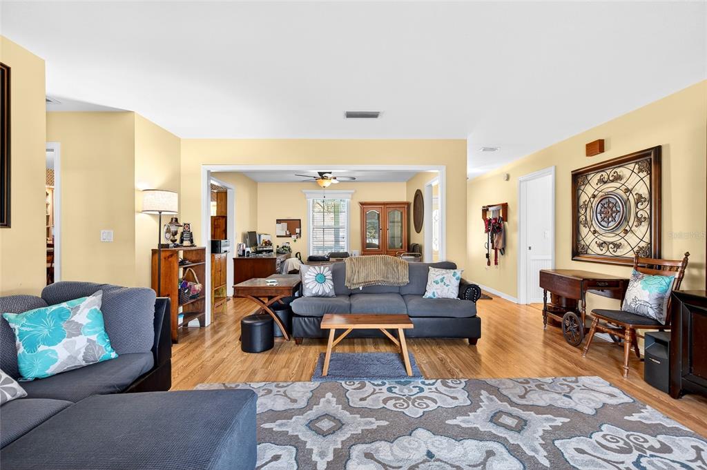 5940 Northeast 57th Loop Silver Springs, FL 34488 - Photo 35 of 44 a living room with furniture and wooden floor