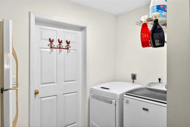 a utility room with dryer and washer