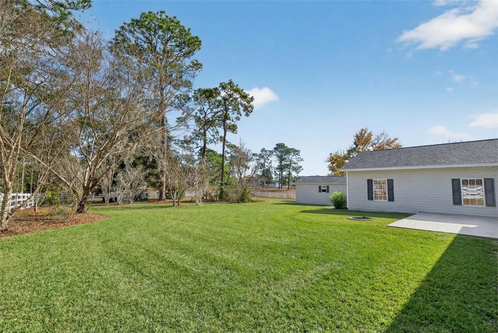 5940 Northeast 57th Loop Silver Springs, FL 34488 - Photo 37 of 44 a house view with a garden space