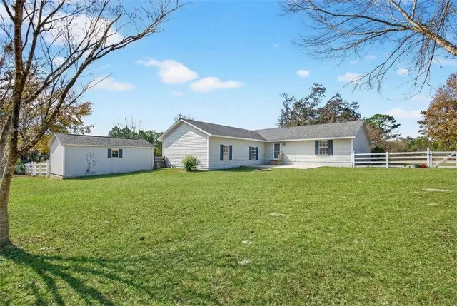 a front view of house with yard and seating area