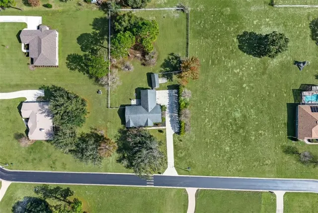 an aerial view of a house having yard