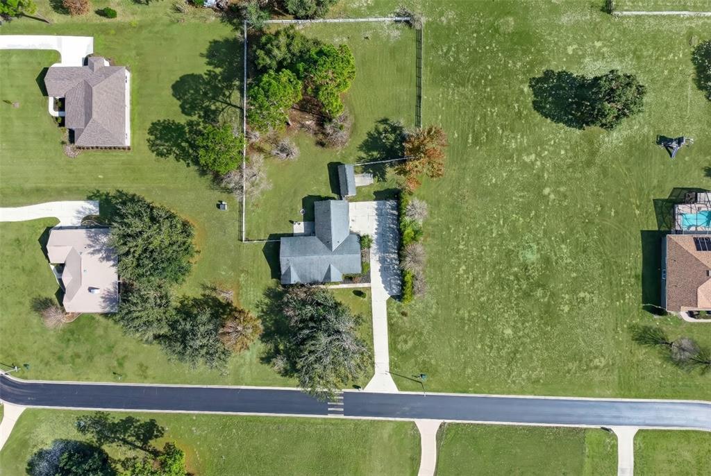 5940 Northeast 57th Loop Silver Springs, FL 34488 - Photo 42 of 44 an aerial view of a house having yard