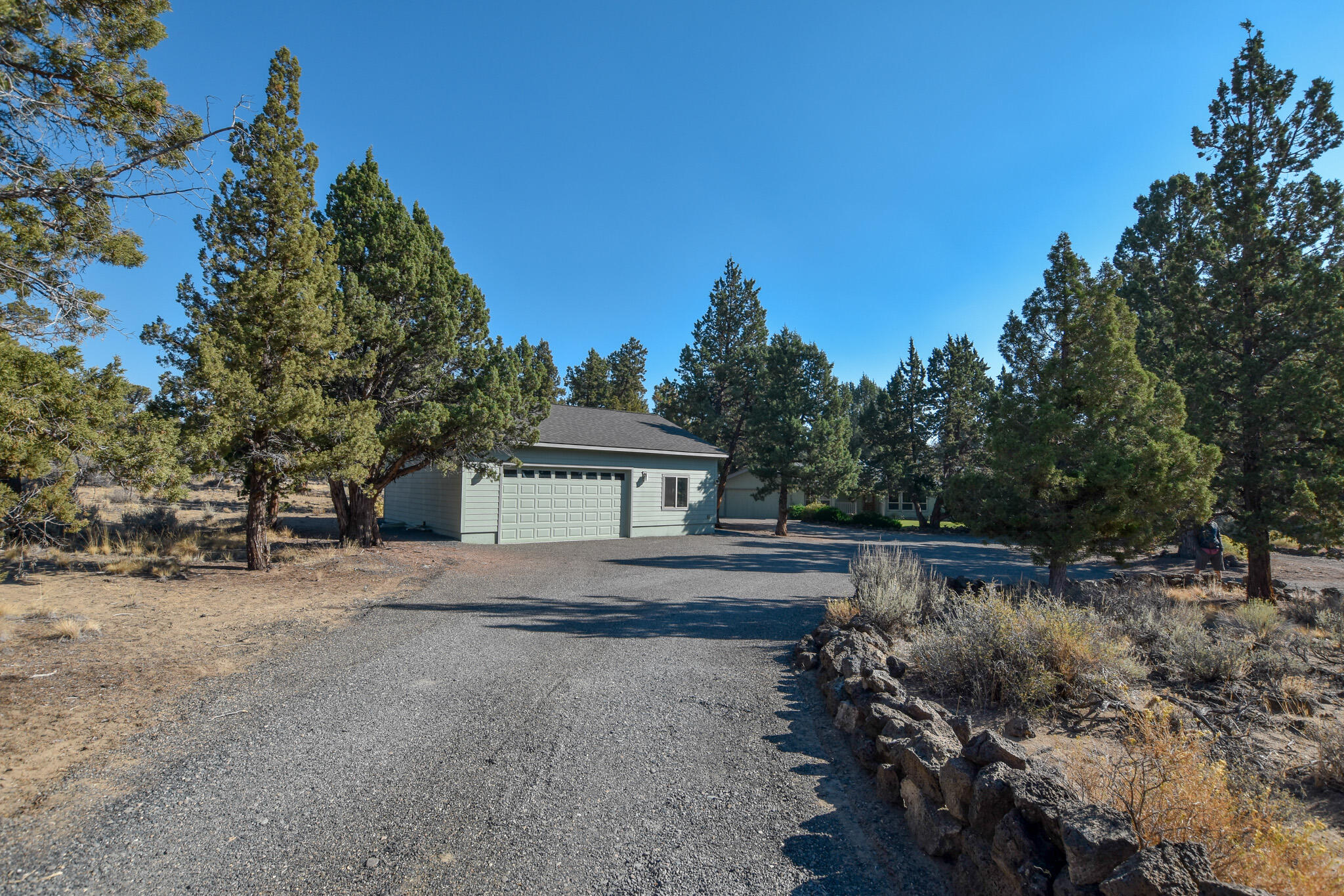 64730 Sylvan Loop Bend, OR 97701 - Photo 44 of 46 a view of house with outdoor space and garden