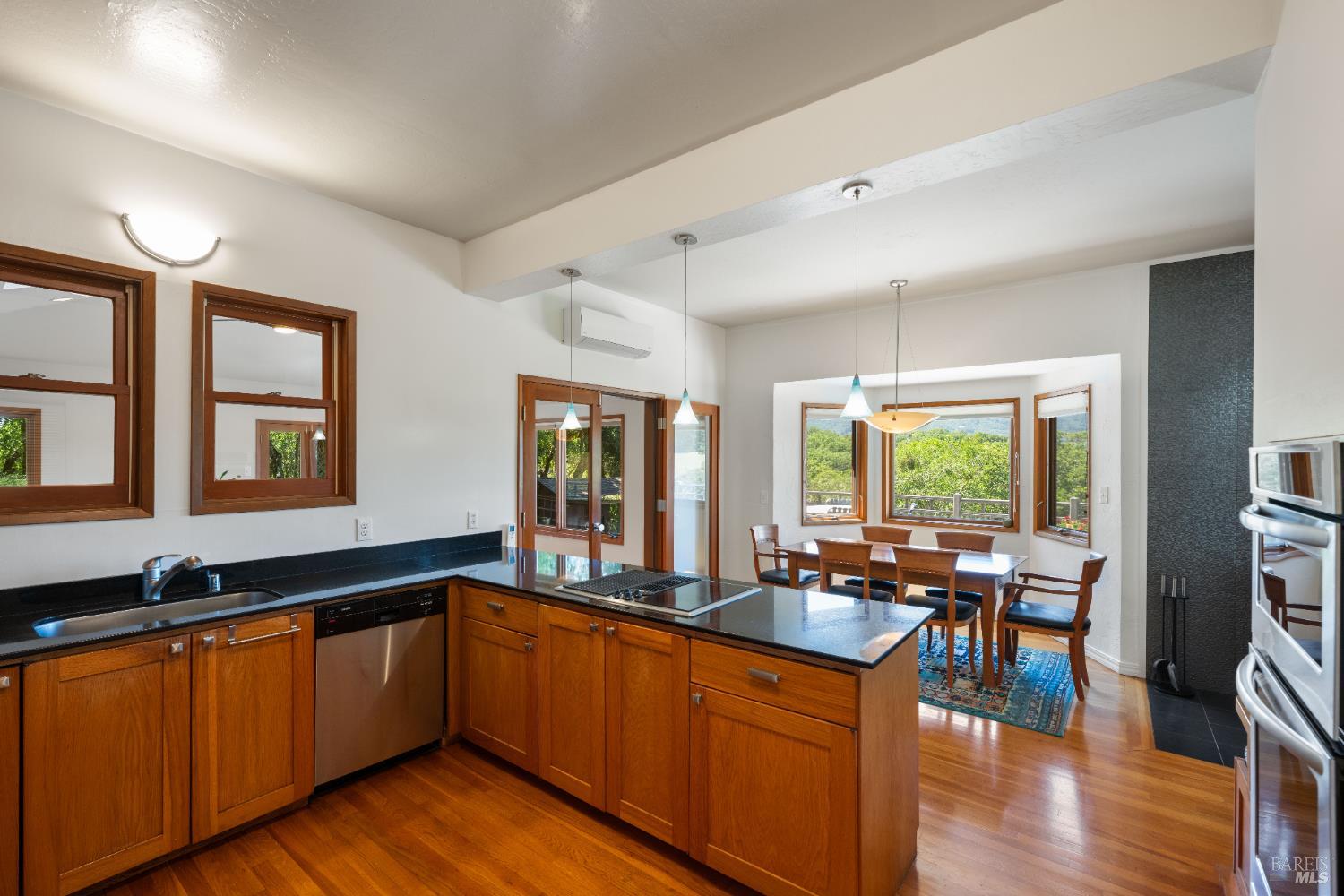 10601 Slattery Road Glen Ellen, CA 95442 - Photo 13 of 45 Slab counters and wood cabinetry make for a warm feel and functionality.