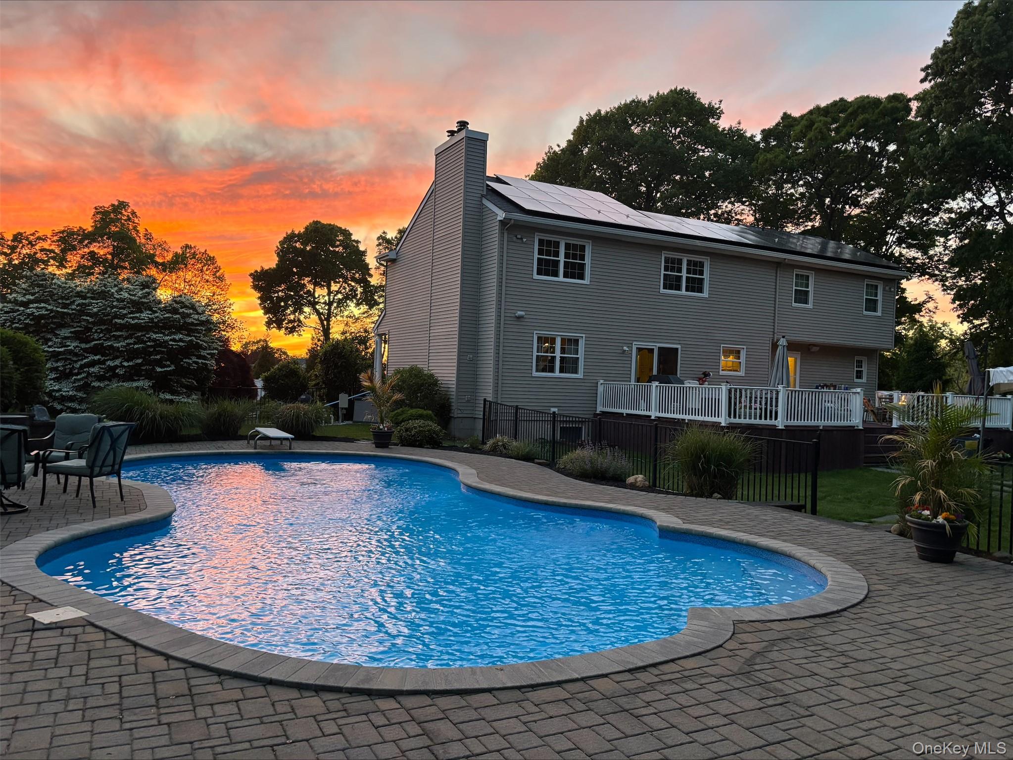 42 Adelia Path Riverhead, NY 11901 - Photo 27 of 30 Featuring the pool and sunset view