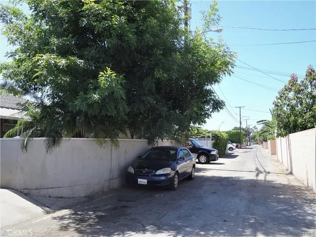 a view of street with parked cars