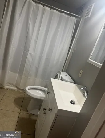 a bathroom with a sink and toilet