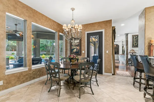 a kitchen with a stove sink and cabinets