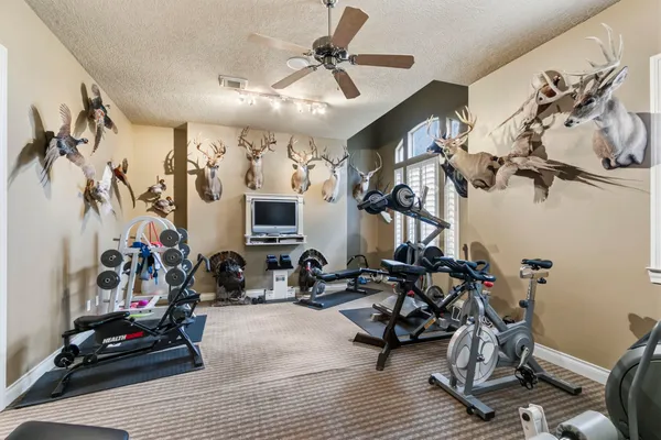a living room with furniture fireplace and flat screen tv