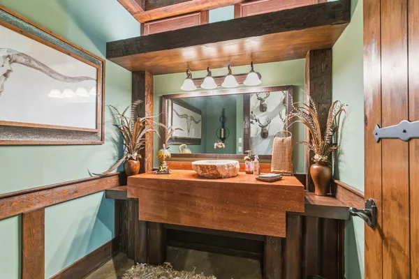 a bathroom with a toilet and a shower curtain