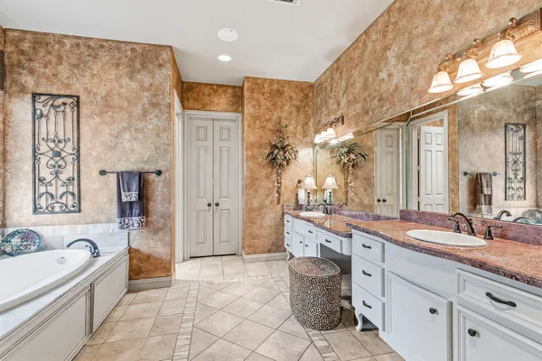 a bedroom with a large bed and a large window