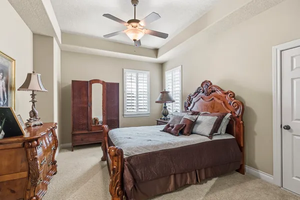 a living room with furniture a air conditioner and a window