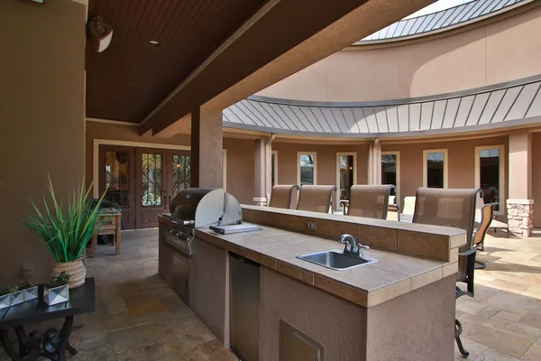 a view of a dinning table and chairs in the patio