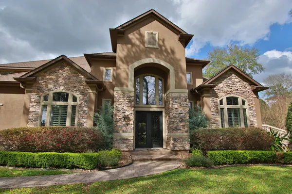 front view of a house with a yard