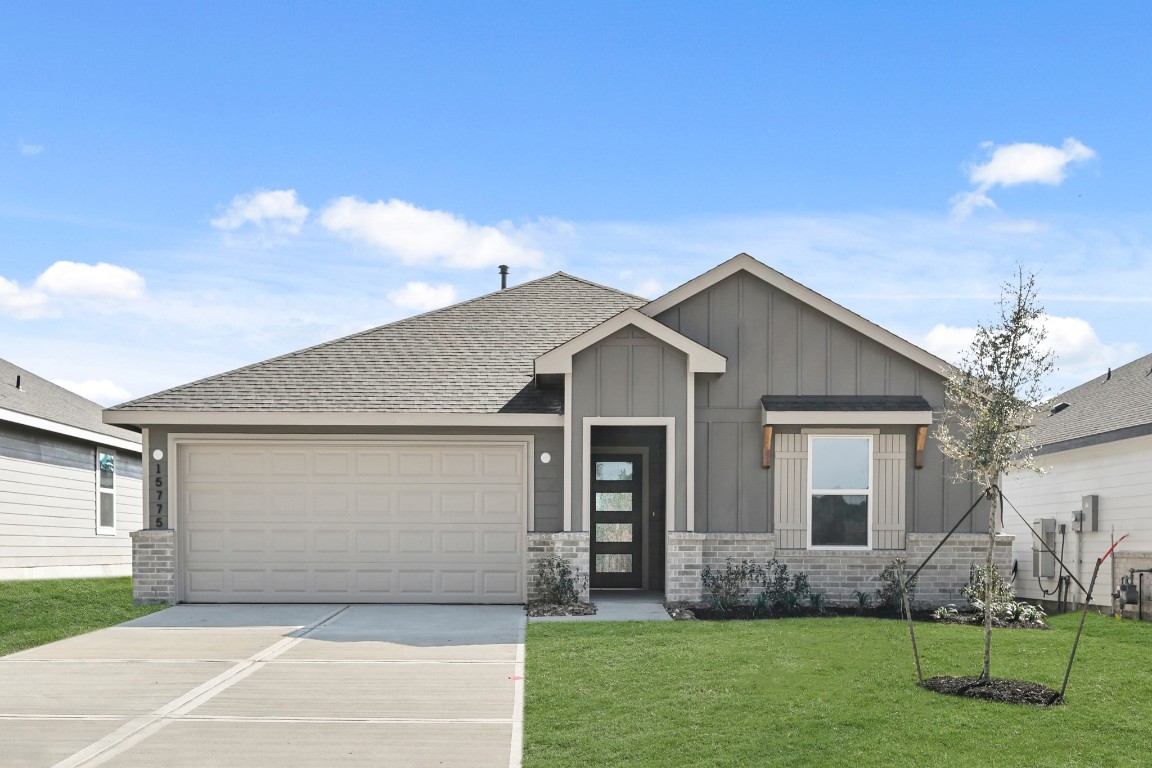 a front view of house with yard and green space