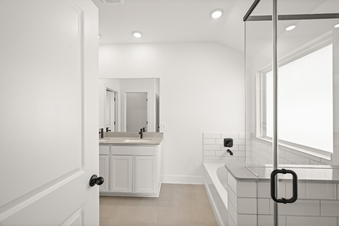 15775 Hanson Ridge Drive Montgomery, TX 77316 - Photo 14 of 33 a bathroom with a sink a toilet and mirror